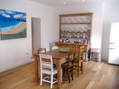 Gorgeous paintings, lovely dresser and smeg fridge 